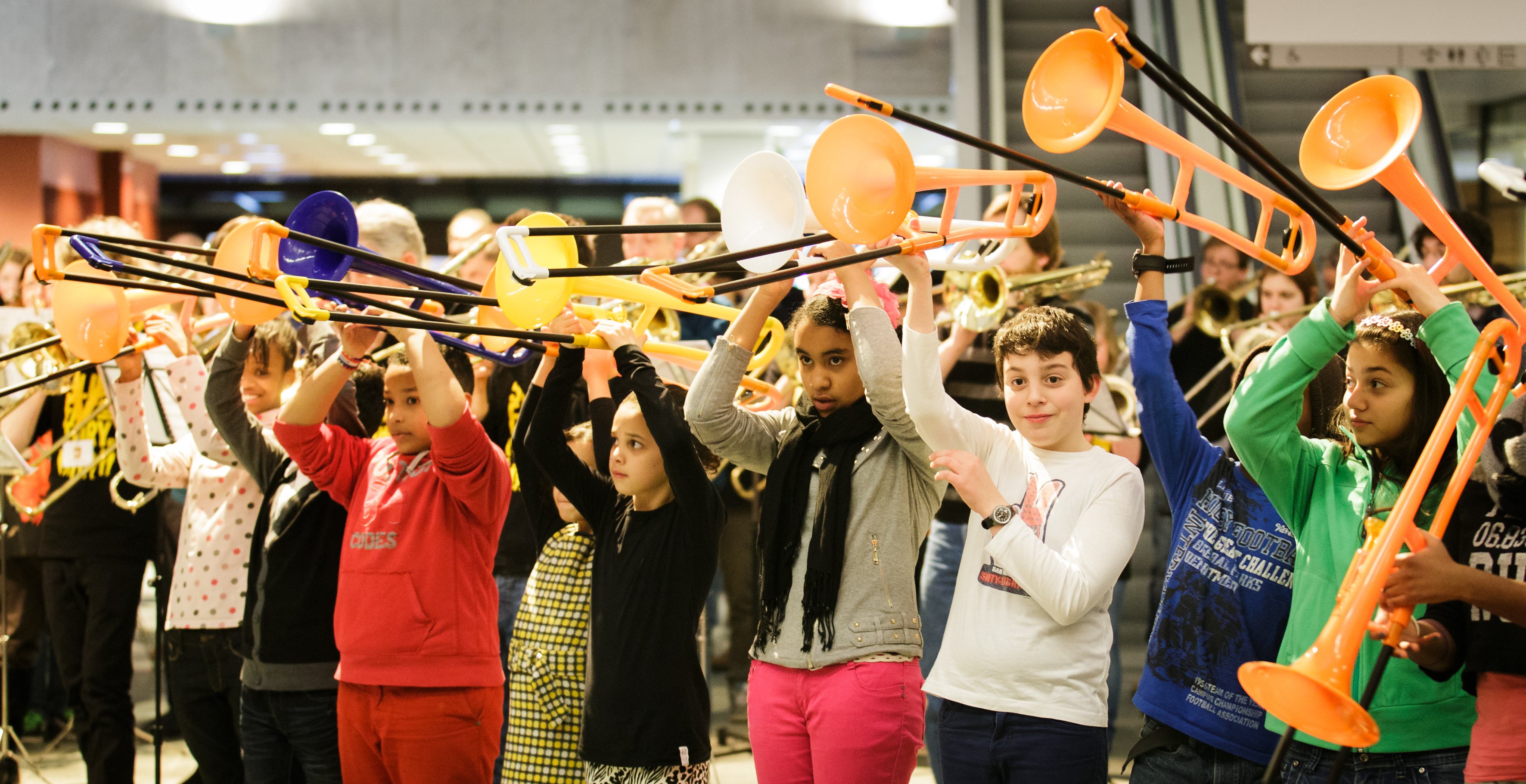 Children holding musical instruments.