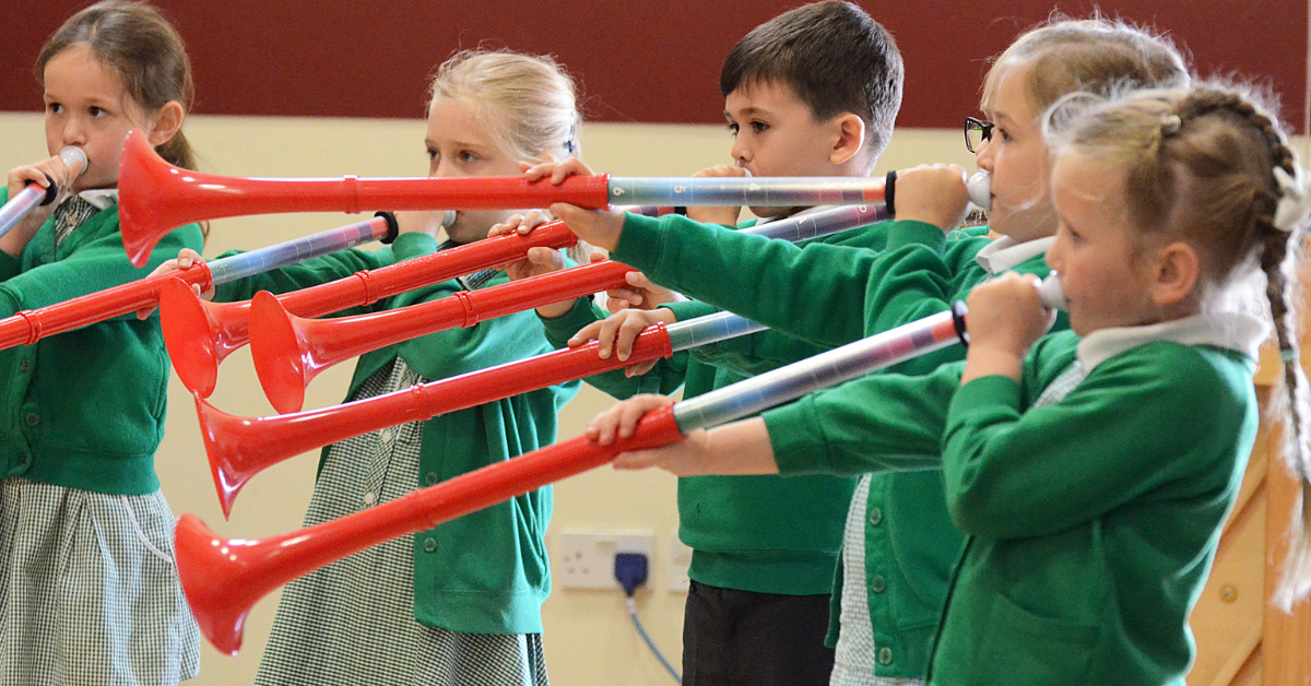 Children playing the pBuzz in the classroom.