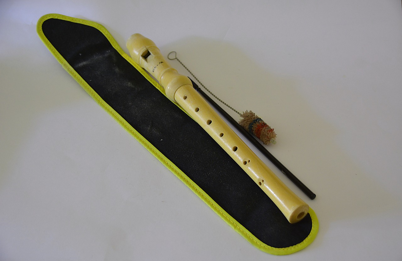 A recorder with a cleaning rod.