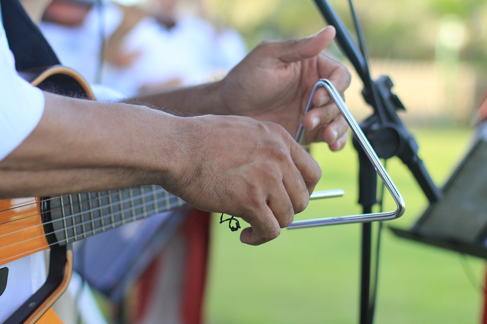A musician playing the triangle.